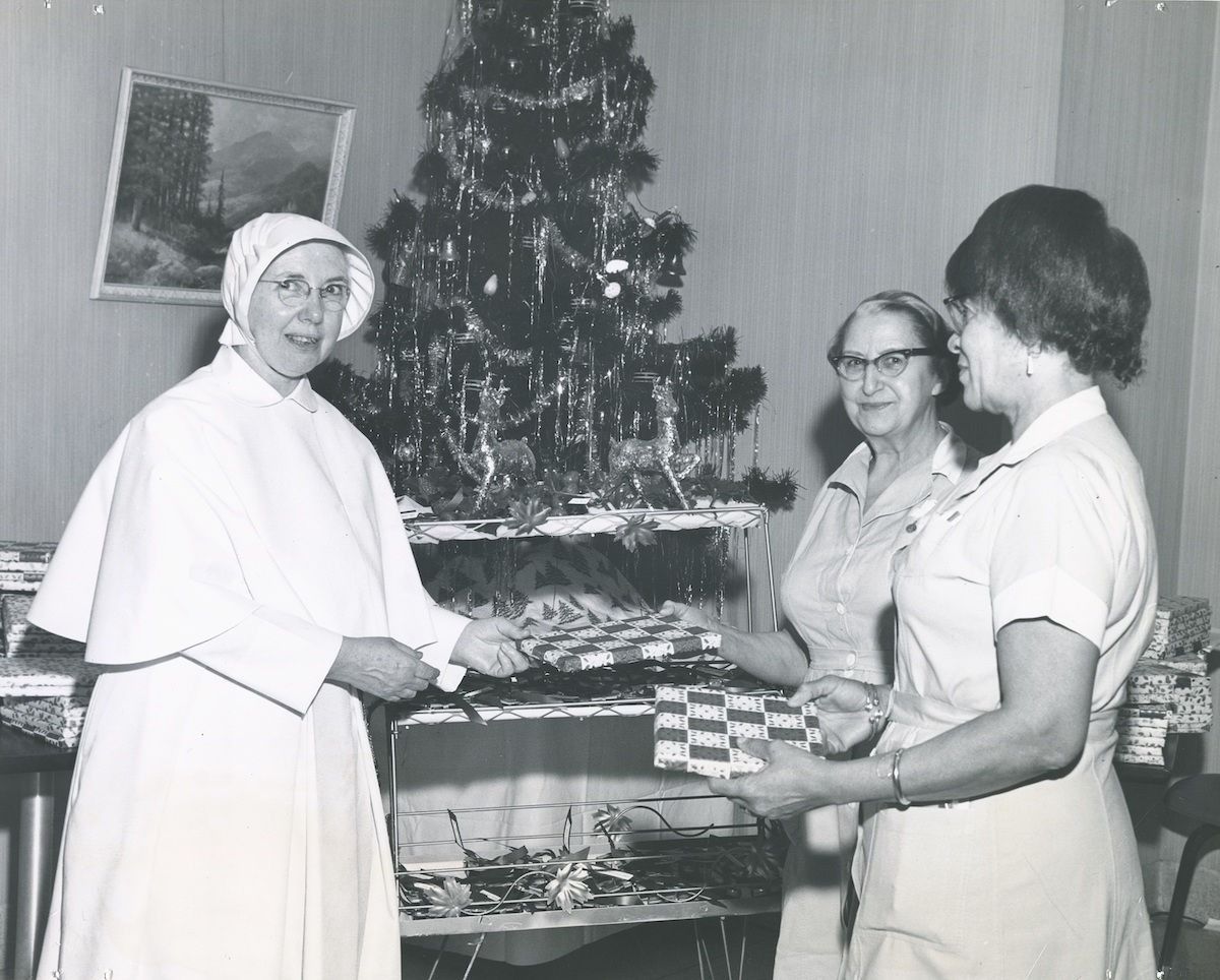 Sr. Anthony Marie Fitzmaurice distributes gifts